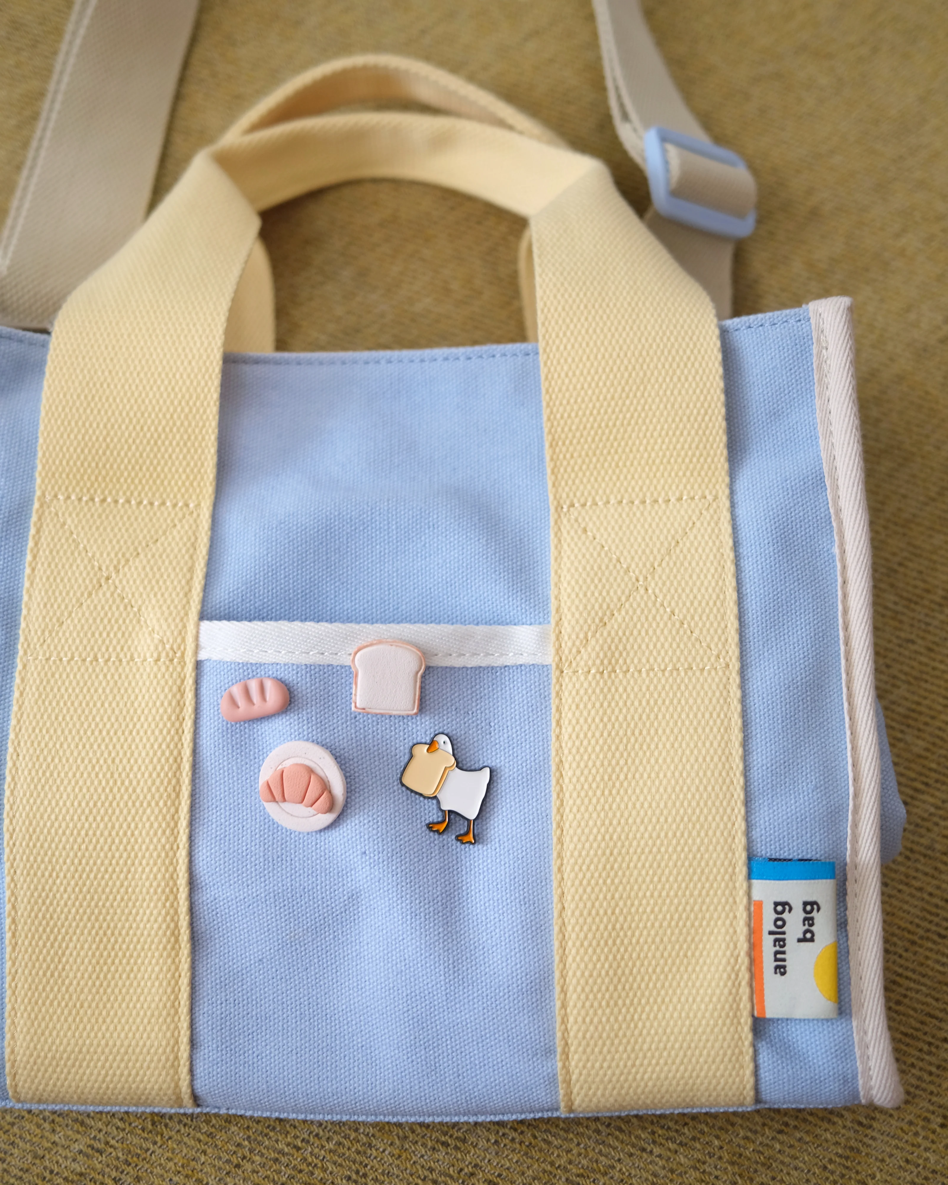 Goose with Bread Enamel Pin - Image 2